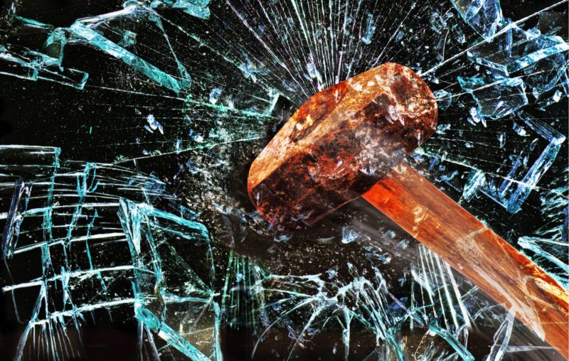 sledgehammer smashing glass
